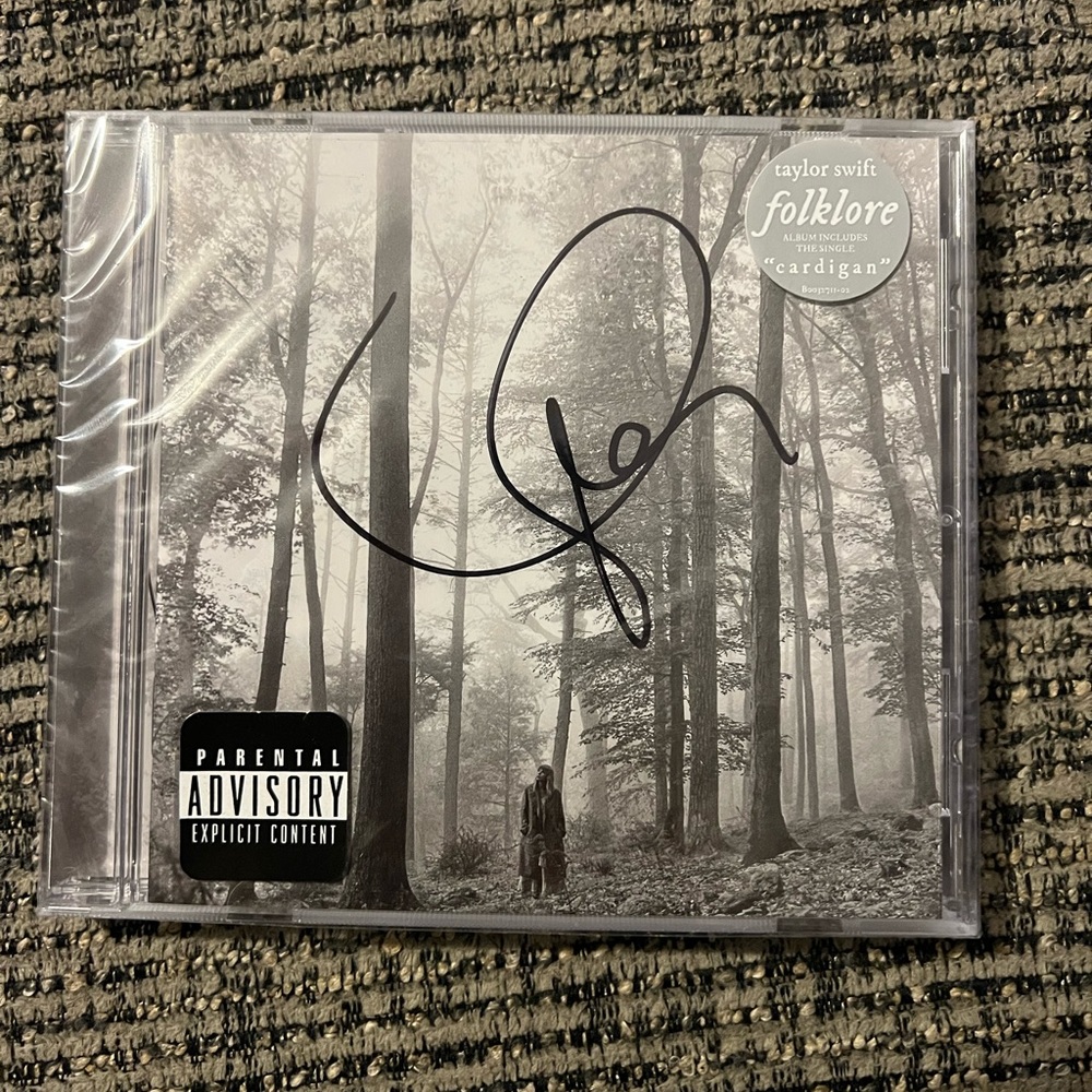 Signed Folklore. Unopened.